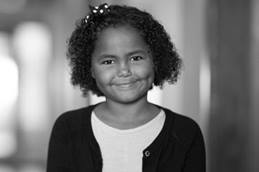 Young Girl Smiling in Hallway