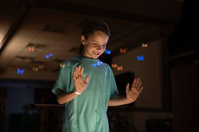 teen girl looking out window