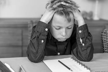 boy with hands in hair