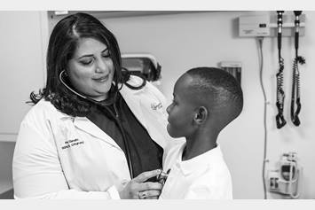 Nurse practitioner examining a patient.