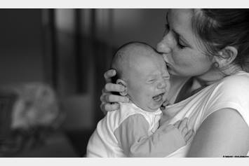 Mom hold screaming baby