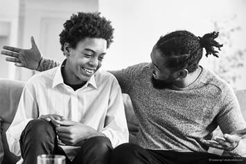 father talking to his son