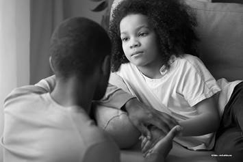 Adult having a conversation with a child