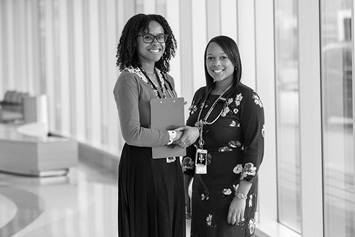 Female residents in hallway