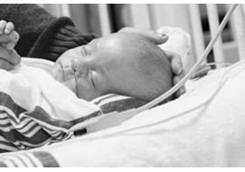 NICU baby in isolette