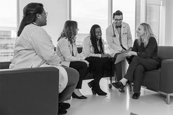 Doctors meeting in hallway area